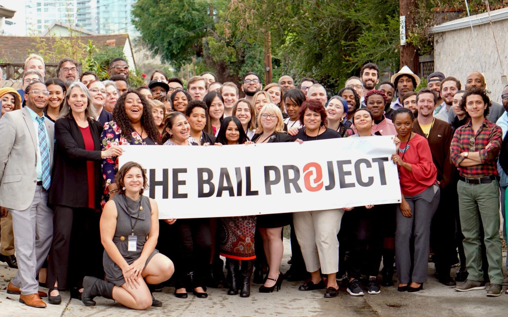 thebailproject group of people holding the bail project tarpaulin